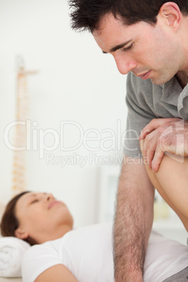 Patient being stretched by a physiotherapist
