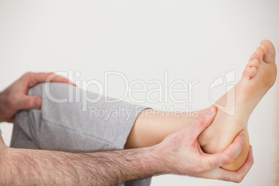 Chiropractor holding the heel of a patient