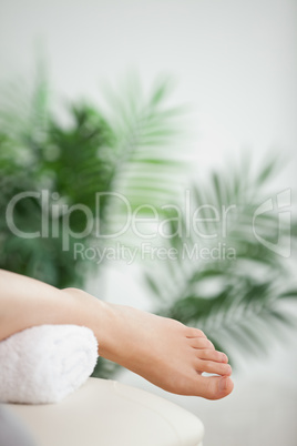 Close-up of a foot placed on a towel