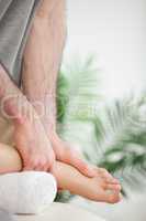 Close up of hands massaging a foot