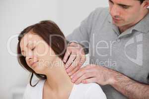 Man massaging the neck of his patient