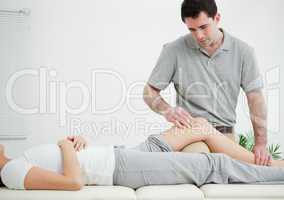 Woman lying on her back while being massaged