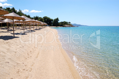 Sunbeds on a beach and turquoise water at the luxury hotel, Halk