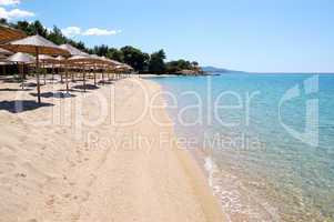 Sunbeds on a beach and turquoise water at the luxury hotel, Halk