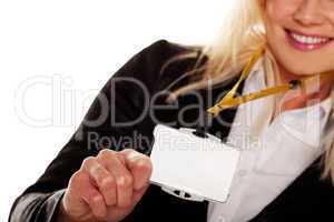 Businesswoman holding up her blank ID tag