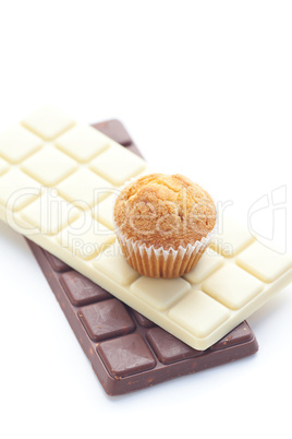 bar of chocolate and muffin isolated on white