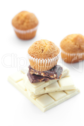 bar of chocolate and muffin isolated on white