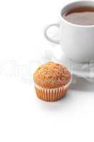 cup of tea and muffin isolated on white