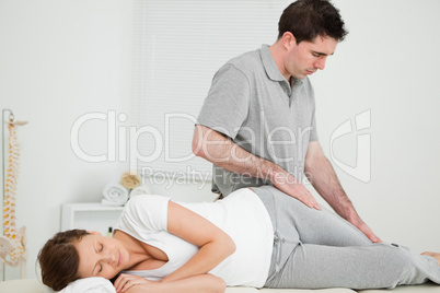 Doctor looking at the thigh of his patient