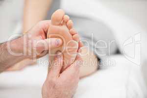 Patient receiving a foot massage