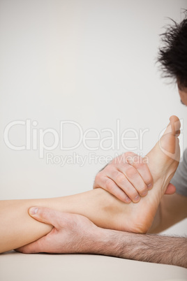 Doctor pressing the side of a foot