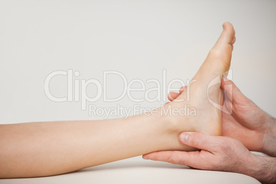 Chiropodist holding the foot of a patient