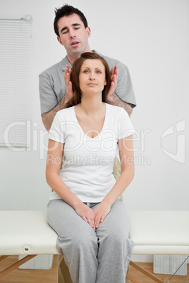 Woman sitting while being manipulated