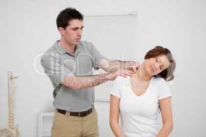 Practitioner looking at the neck of a patient