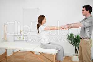 Manual stretching being made by a doctor