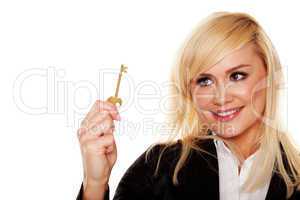 Successful woman holding brass key