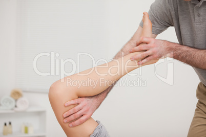 Leg being stretched by a doctor