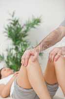 Peaceful woman lying on a medical table with her knees bent