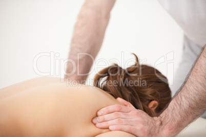 Doctor massaging the shoulders of woman while standing