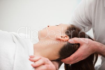Doctor manipulating the neck of a woman