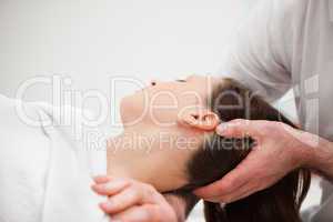 Doctor manipulating the neck of a woman