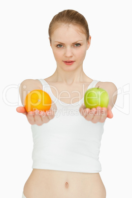 Woman presenting fruits