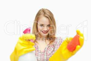 Woman holding cleaning products