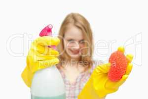 Woman presenting cleaning products