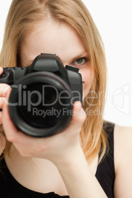 Close up of a woman holding a camera