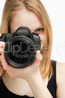 Close up of a woman holding a camera