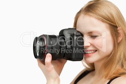 Smiling woman holding a camera