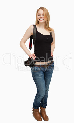 Cheerful woman holding a camera