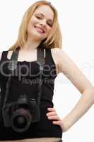 Joyful woman holding a camera