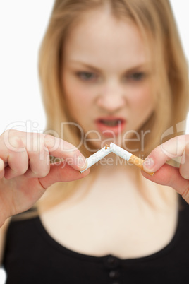 Woman braking a cigarette