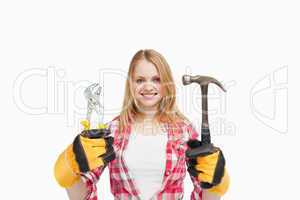 Woman holding tools while smiling