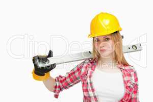 Serious woman holding a spirit level