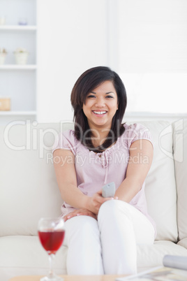 Smiling woman sitting on a couch