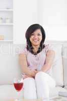 Smiling woman sitting on a couch