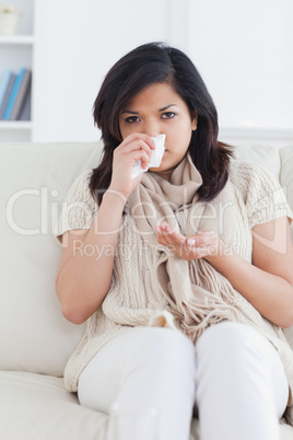 Woman blowing her nose