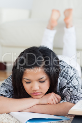 Woman crossing her arms while she reads a book