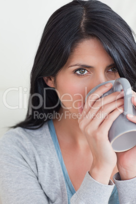 Close-up of a woman drinking from a mug