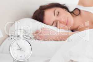 Brunette woman sleeping in the morning