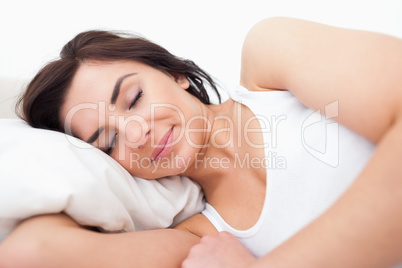 Peaceful woman lying while sleeping in the morning