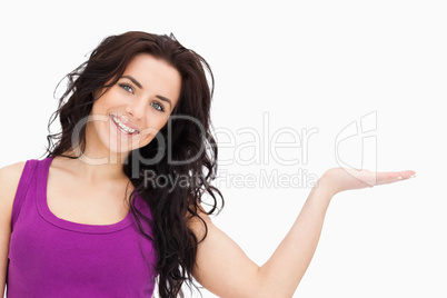 Beautiful student in purple top presenting with her palm