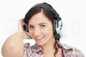 Brunette listening to music with headphones