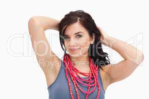 Brunette wearing a red bead necklace