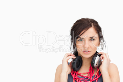beautiful student with headphones around her neck