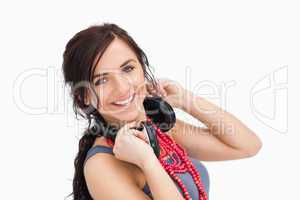 Modern young woman with a headphones around her neck