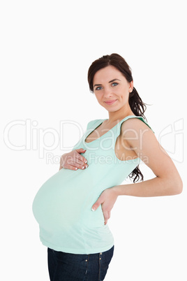 Pregnant woman holding her back