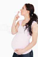 Young pregnant woman smoking